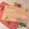 A wooden cutting board with the word moms richardson on it.