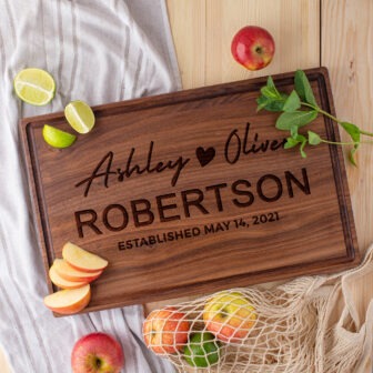 A wooden cutting board with the name of robert robertson.