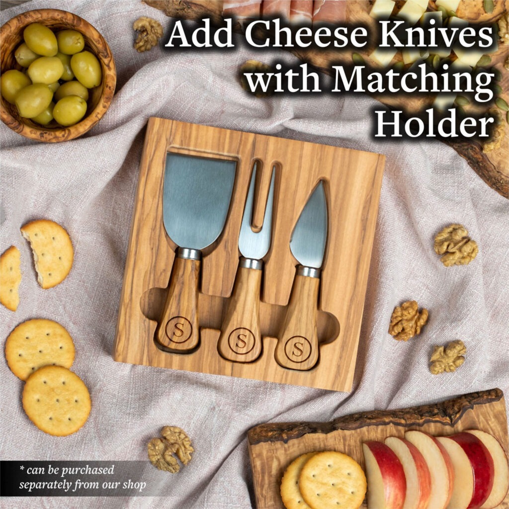 Wooden cheese knife set with holder displayed alongside crackers and olives on a table.