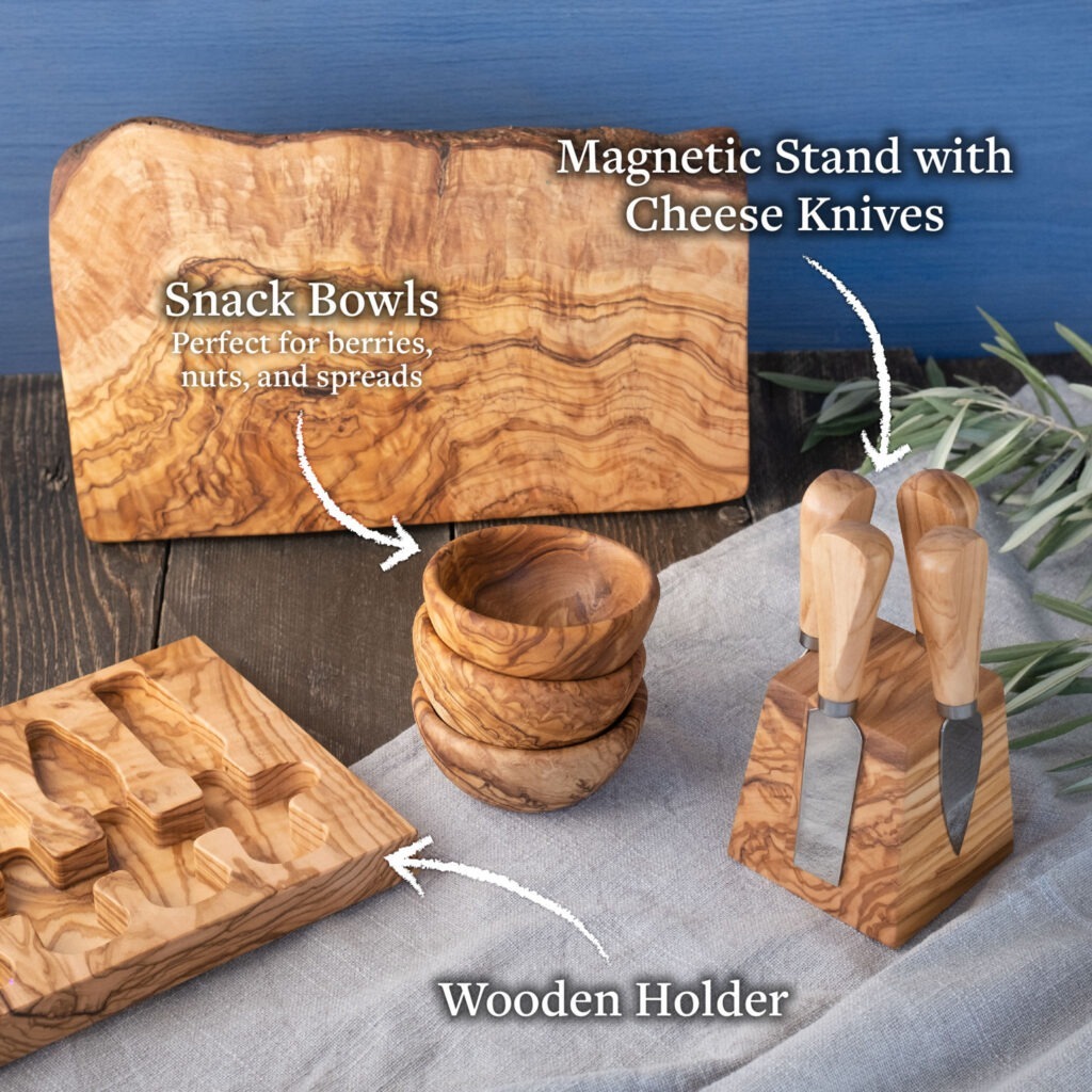 A cheese board with cheese knives and a wooden holder.