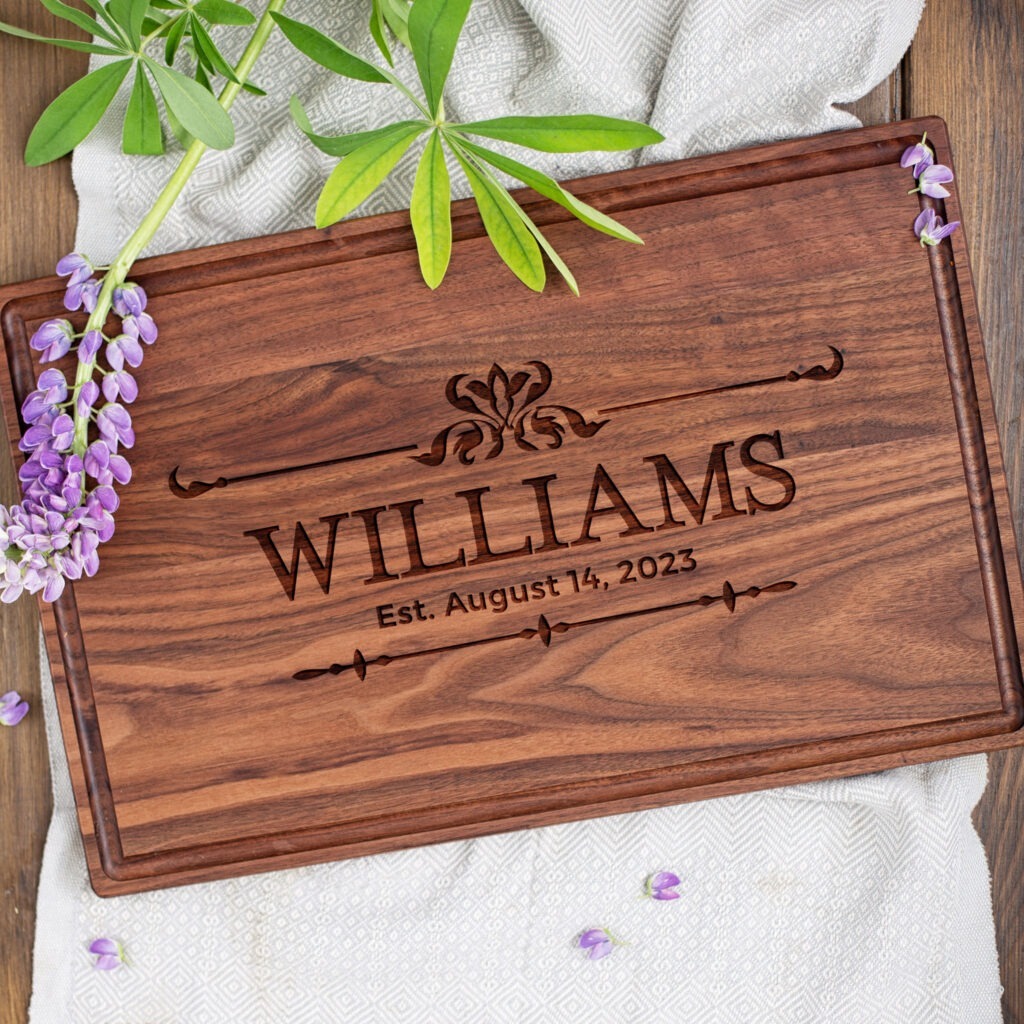 A wooden cutting board with the name williams on it.