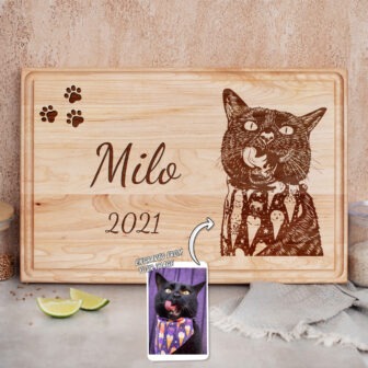 Custom-engraved wooden pet memorial featuring the name "milo" and a likeness of a cat based on the inset photo.