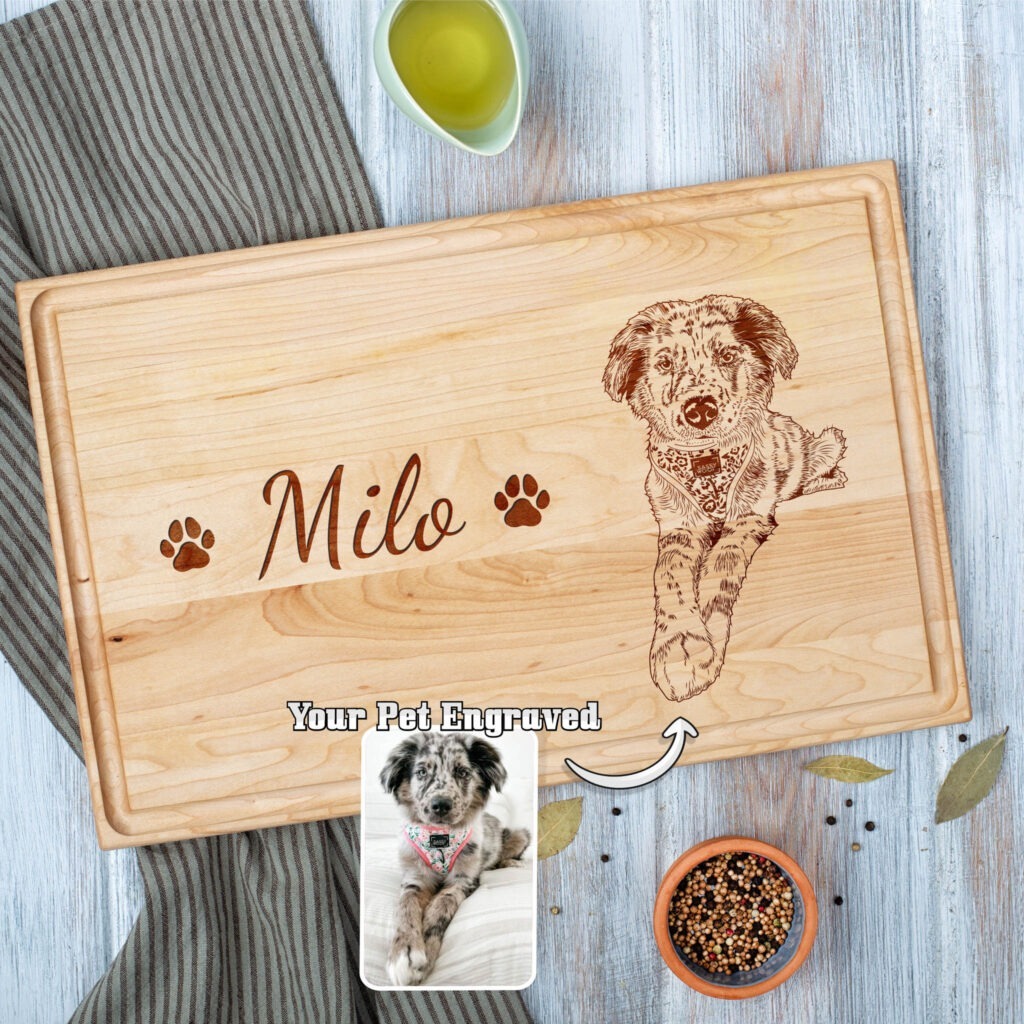 Custom-engraved wooden cutting board featuring the name "milo" and an image of a dog, with a bowl of spices and olive oil on a table.