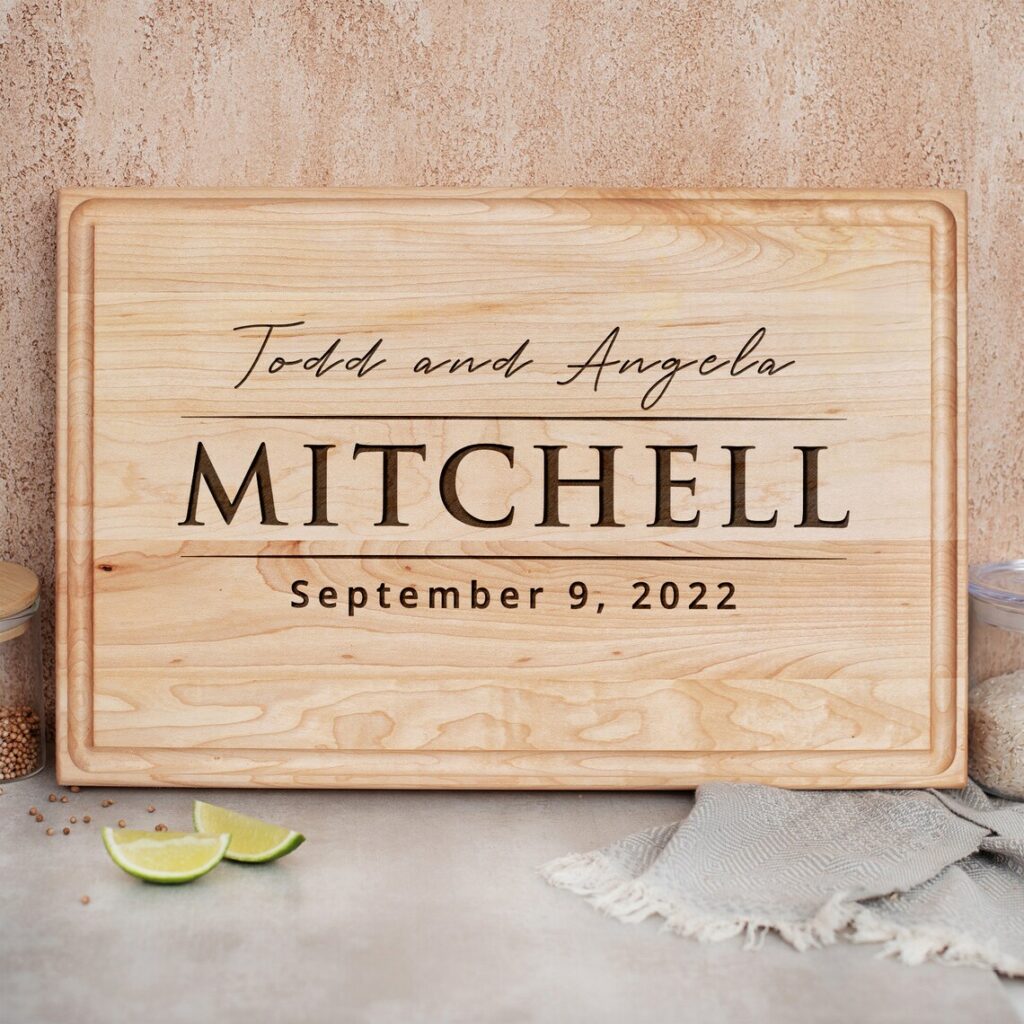 A wooden cutting board with the word mitchell on it.