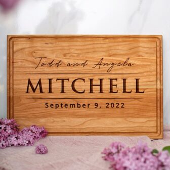 A wooden cutting board with the words'todd and mitchell'.