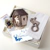 Client Christmas gift box with a carved deer tea light holder and chocolate