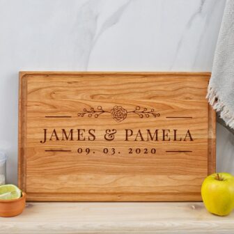 Personalized wedding gift for couple: engraved wooden cutting board.