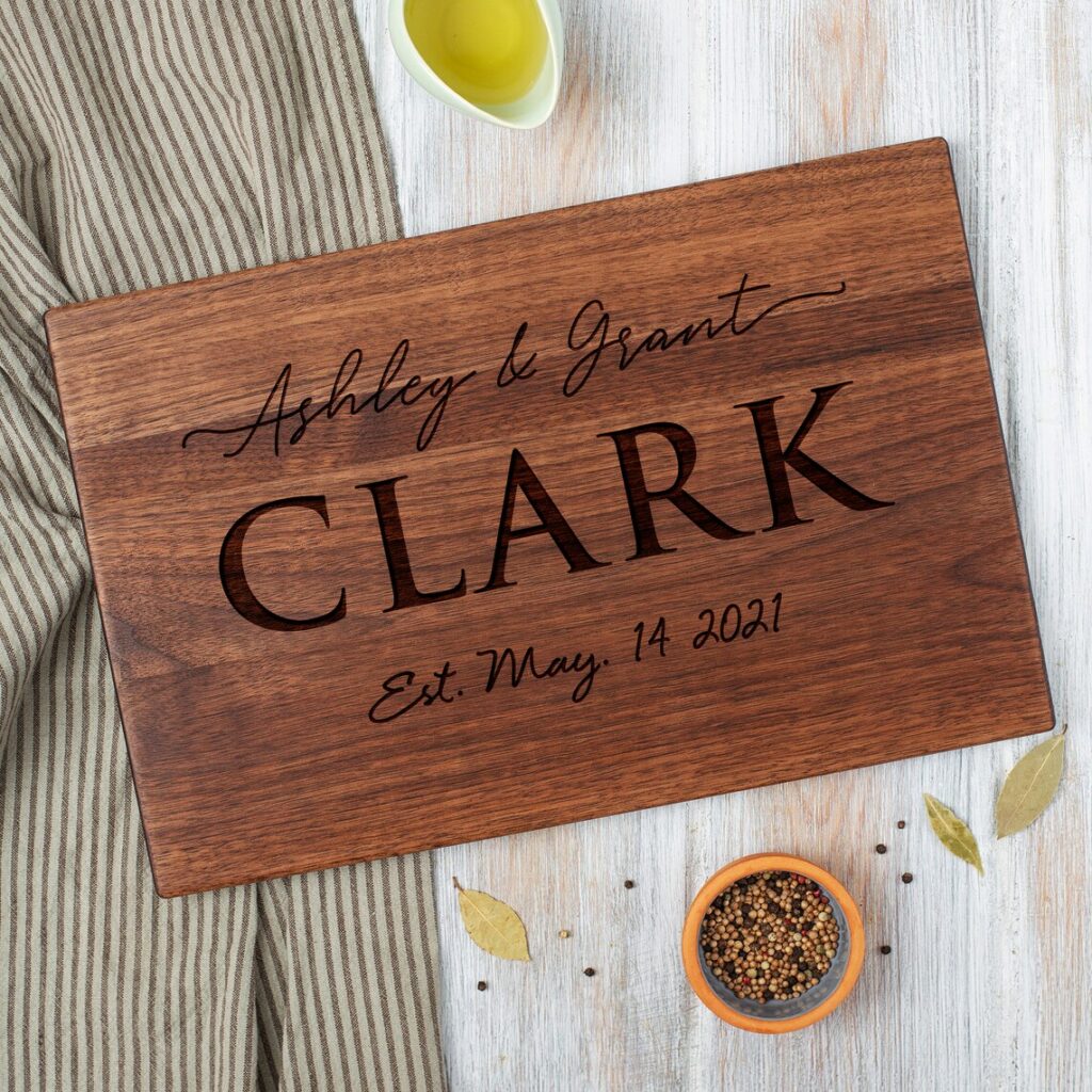 A wooden cutting board with the word clark on it.