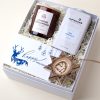 Employee holiday gift box with a candle, cocoa and wooden star ornament