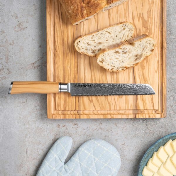 Bread knife engraved with a name on an olive wood board