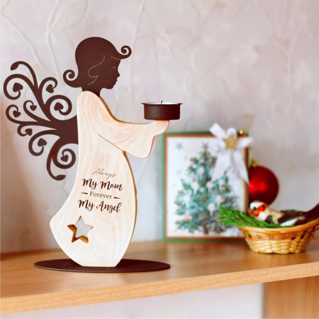 A wooden angel holding a candle on a shelf.
