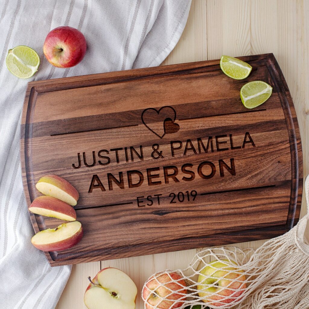 A Anniversary Cheese Board with the name Justin Pamela Anderson on it.