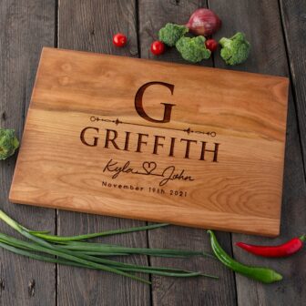 A Cherry Wood Cutting Board with the name g Griffith on it.