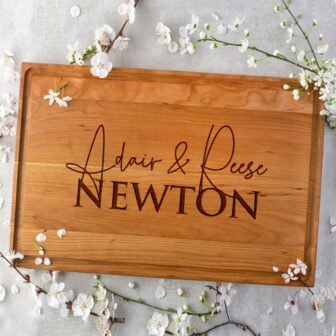 Personalized Cutting Board Wedding Gift with the words Adair and Reese newton.