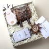 Kids Christmas gift box with a personalized reindeer coin bank and cocoa