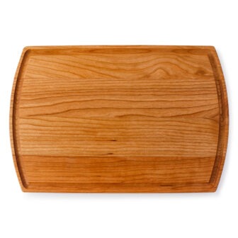 A rustic wooden chopping board on a white background.