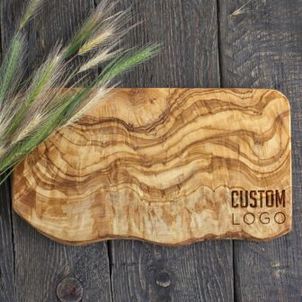 An olive wood cutting board with logo.