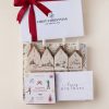 New home Christmas gift box with advent candles and holiday matches