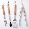 Four-piece olive wood BBQ tool set with fork, brush, spatula and tongs