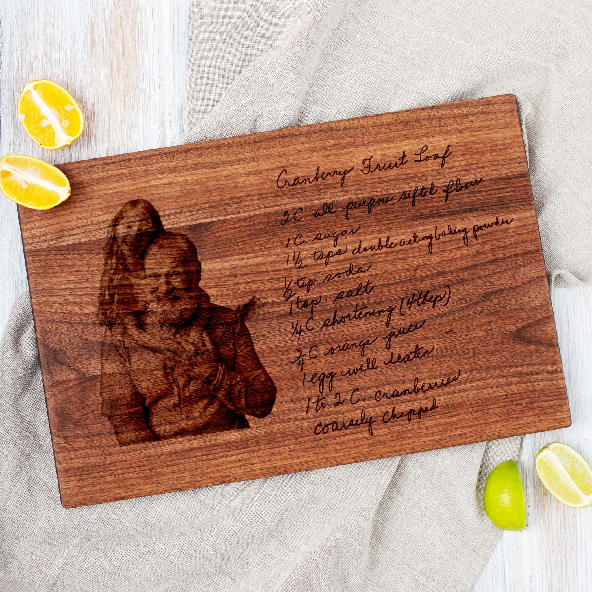 A handwritten recipe cutting board with an engraved family image.