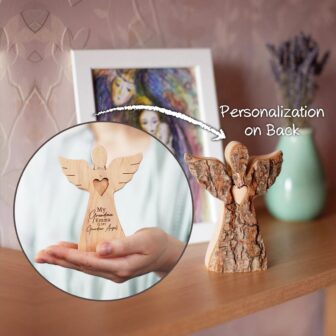 A wooden angel with a heart on it is on a shelf.