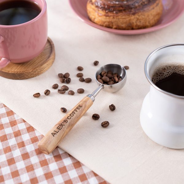Personalized coffee scoop with an engraved olive wood handle