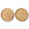 Two circular wooden coasters with a raised edge.