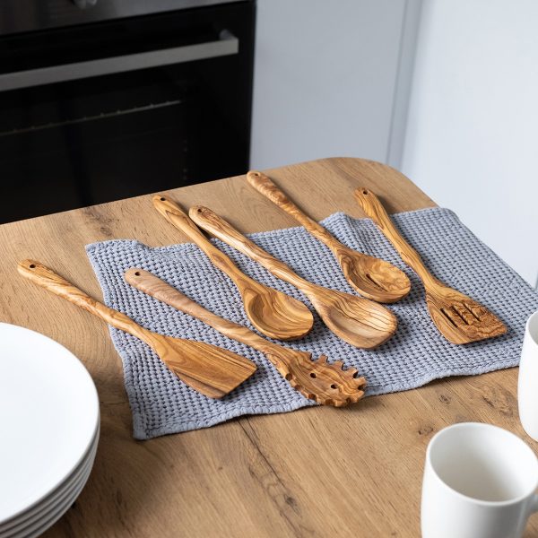 Olive wood cooking utensils on a kitchen table